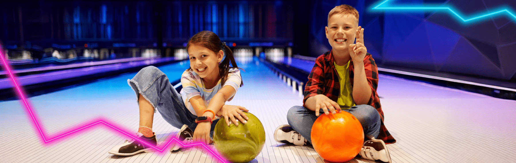 2 kids posing on the lanes